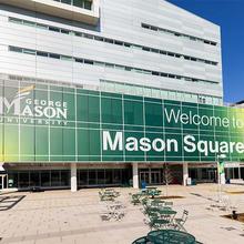 The Mason Square logo on top of the Arlington campus building
